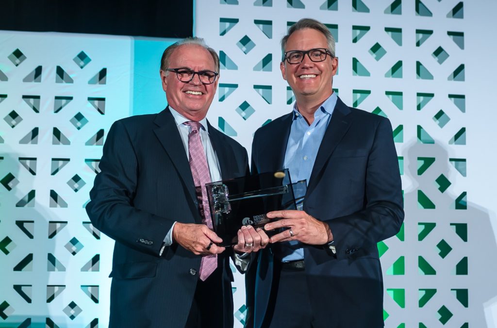 Incoming Chamber board chair, George Sparks, receives the passing of the gavel from former board chair, Mark Spiecker