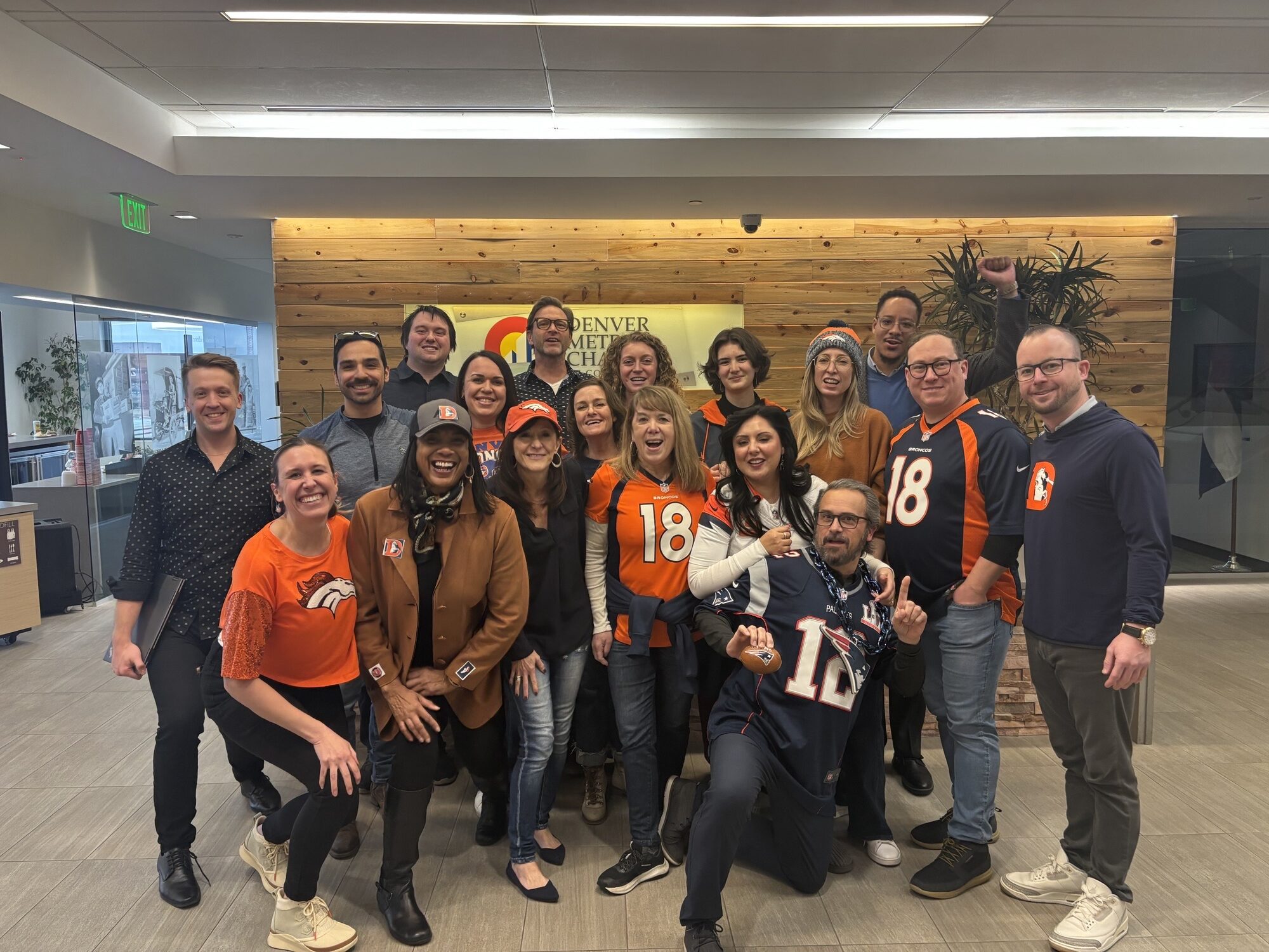 Denver Metro Chamber staff proudly show off their Broncos gear