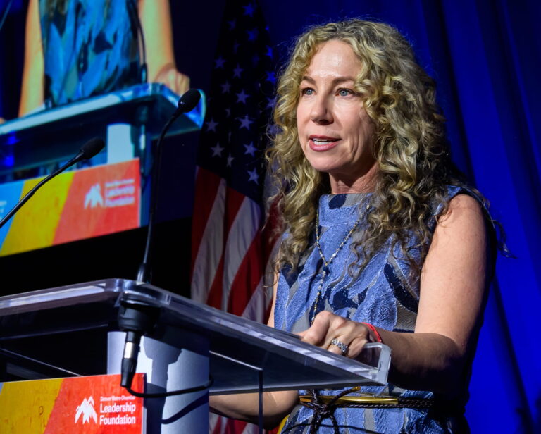 Denver Metro Chamber Leadership Foundation President Kristen Blessman at the podium for Leading Colorado