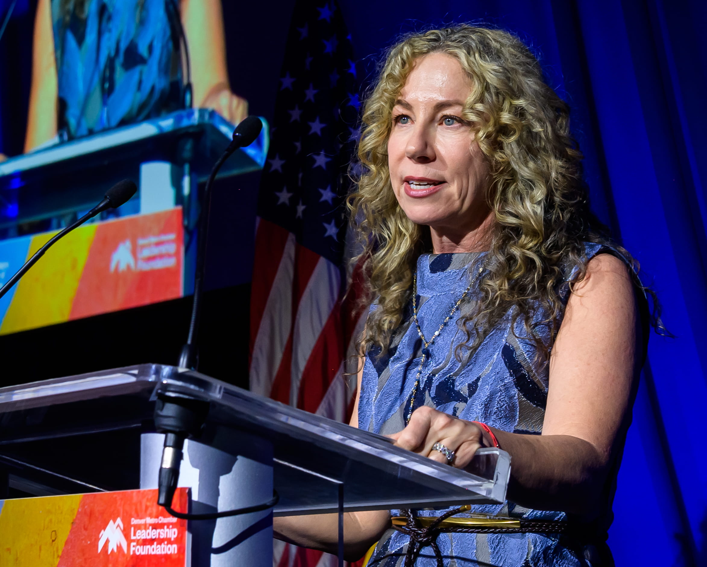 Denver Metro Chamber Leadership Foundation President Kristen Blessman at the podium for Leading Colorado