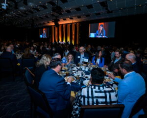 An audience watches the State of the State program