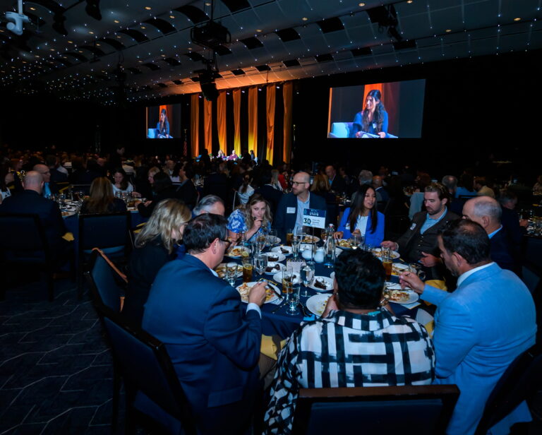 An audience watches the State of the State program